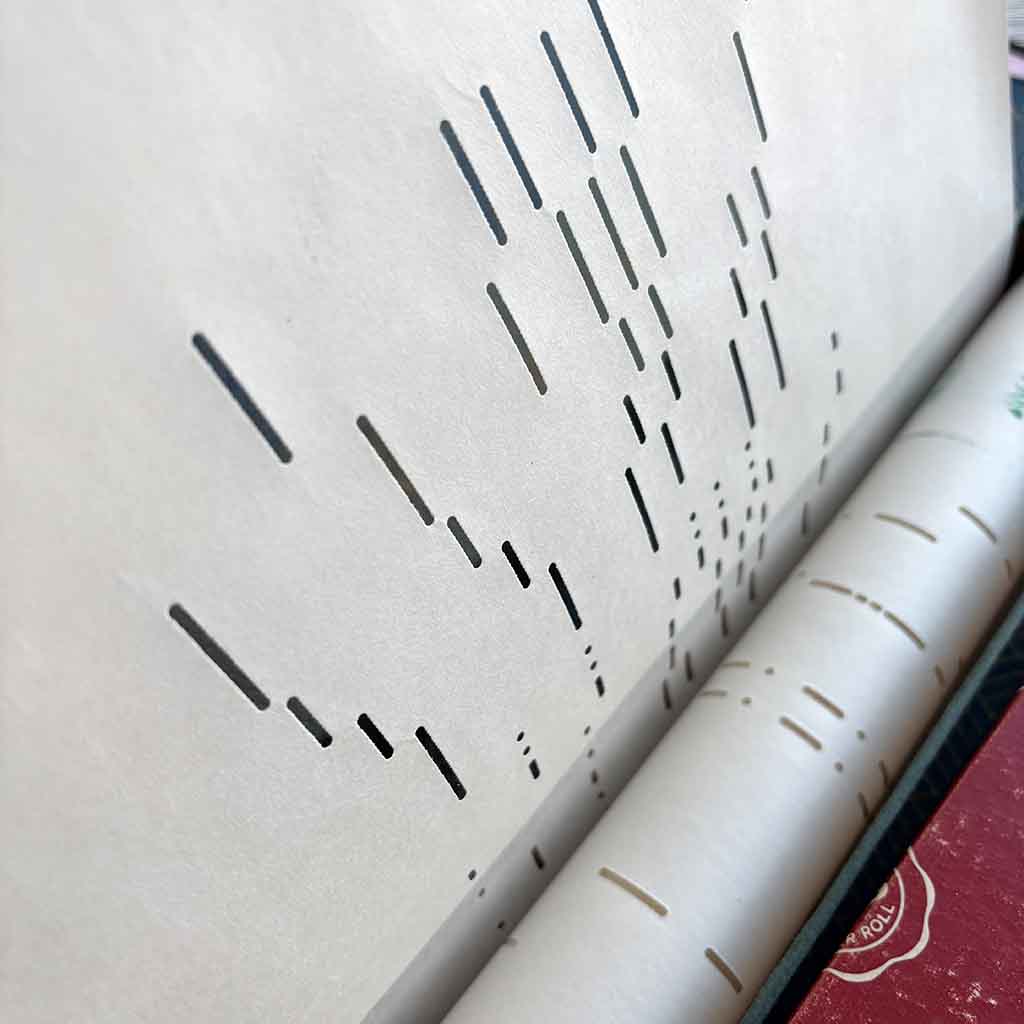 close up of player piano paper