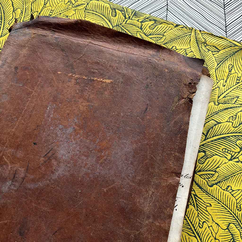 a 1800s Workman's Cypher against a bright yellow background