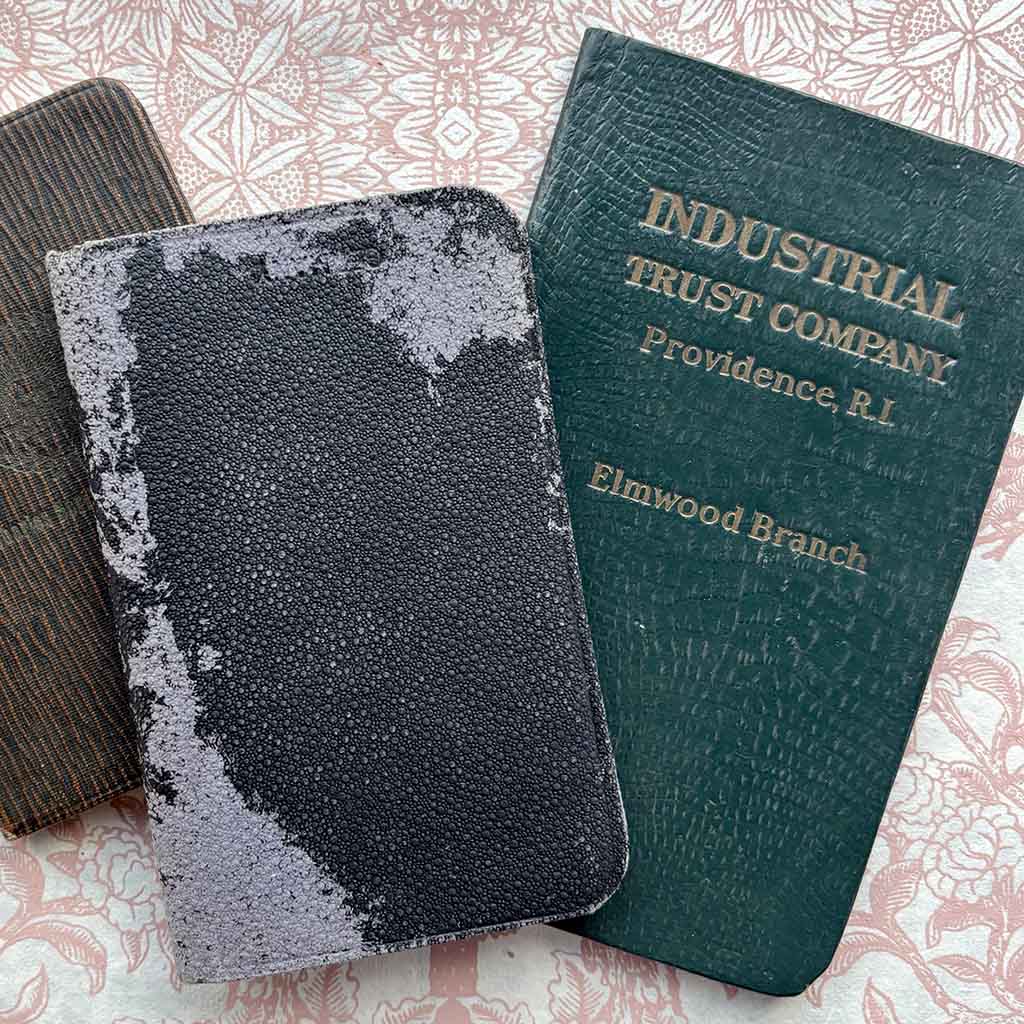 three pocket sized books